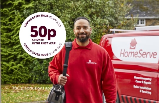 man in HomeServe uniform standing next to van